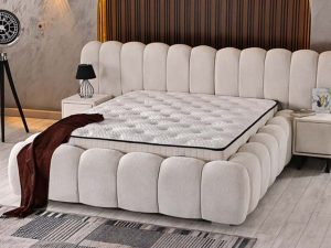 Osimhen boxspring in crèmekleurige bouclélook met afgerond hoofdbord en geïntegreerde nachtkastjes